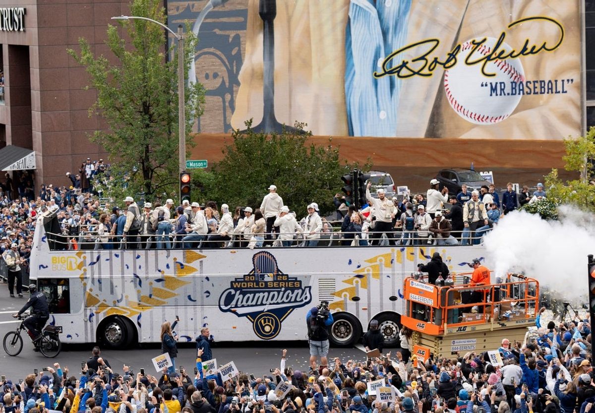 Milwaukee Brewers team drive pass the Bob Uecker mural during the World Series parade in Milwaukee, on Oct. 30, 2026.