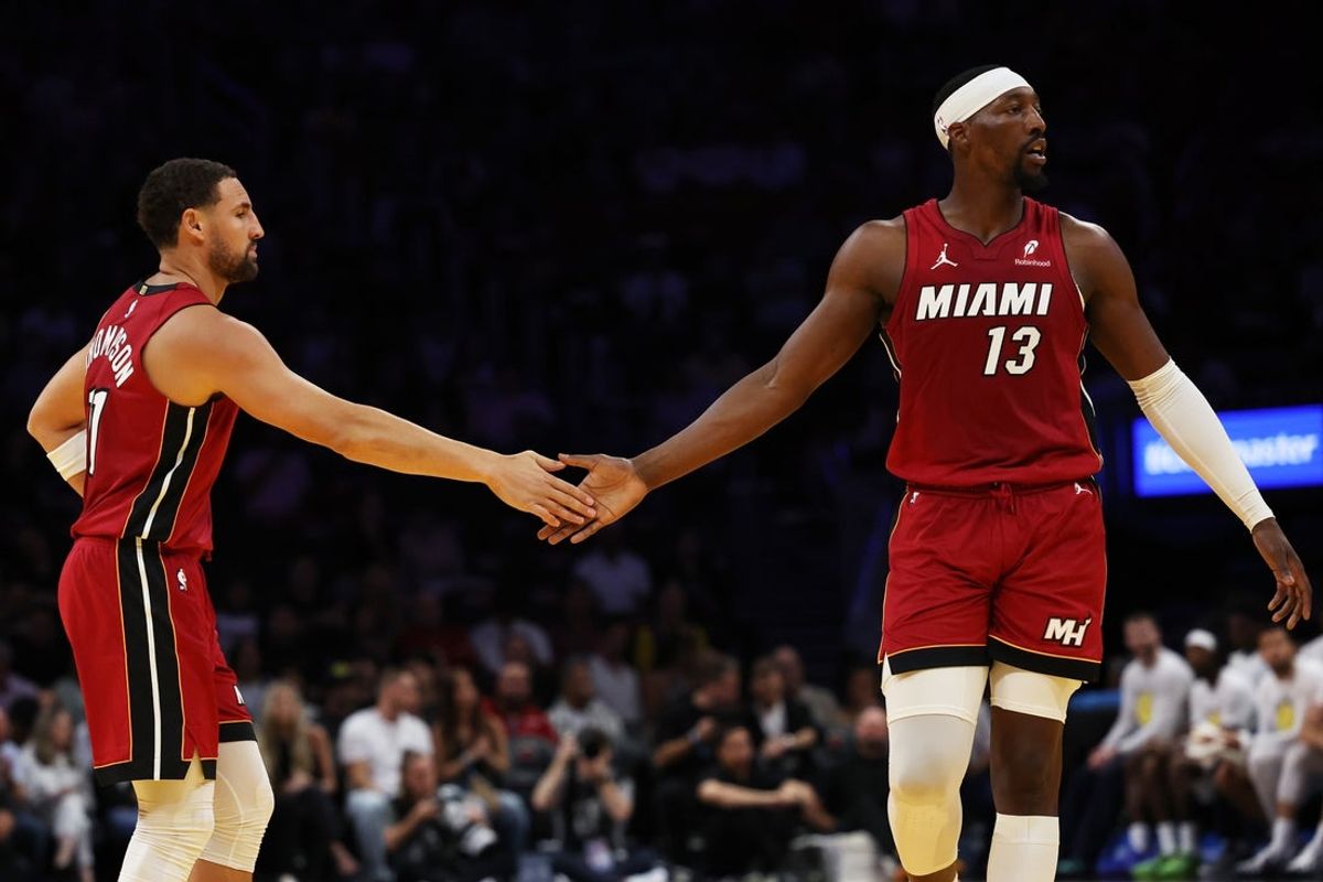 Oct 30, 2026; Miami, Florida, USA;  Miami Heat center Bam Adebayo (13) high fives Miami Heat guard Klay Thompson (11) during the first quarter at Kaseya Center.  Mandatory Credit: Isabella Frias-Imagn Images