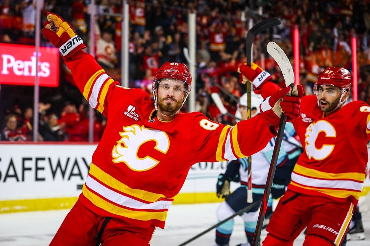 Oct 30, 2026; Calgary, Alberta, CAN; Calgary Flames left wing Joel Farabee (86) celebrates his goal with teammates against the Seattle Kraken during the second period at Scotiabank Saddledome. Mandatory Credit: Sergei Belski-Imagn Images
