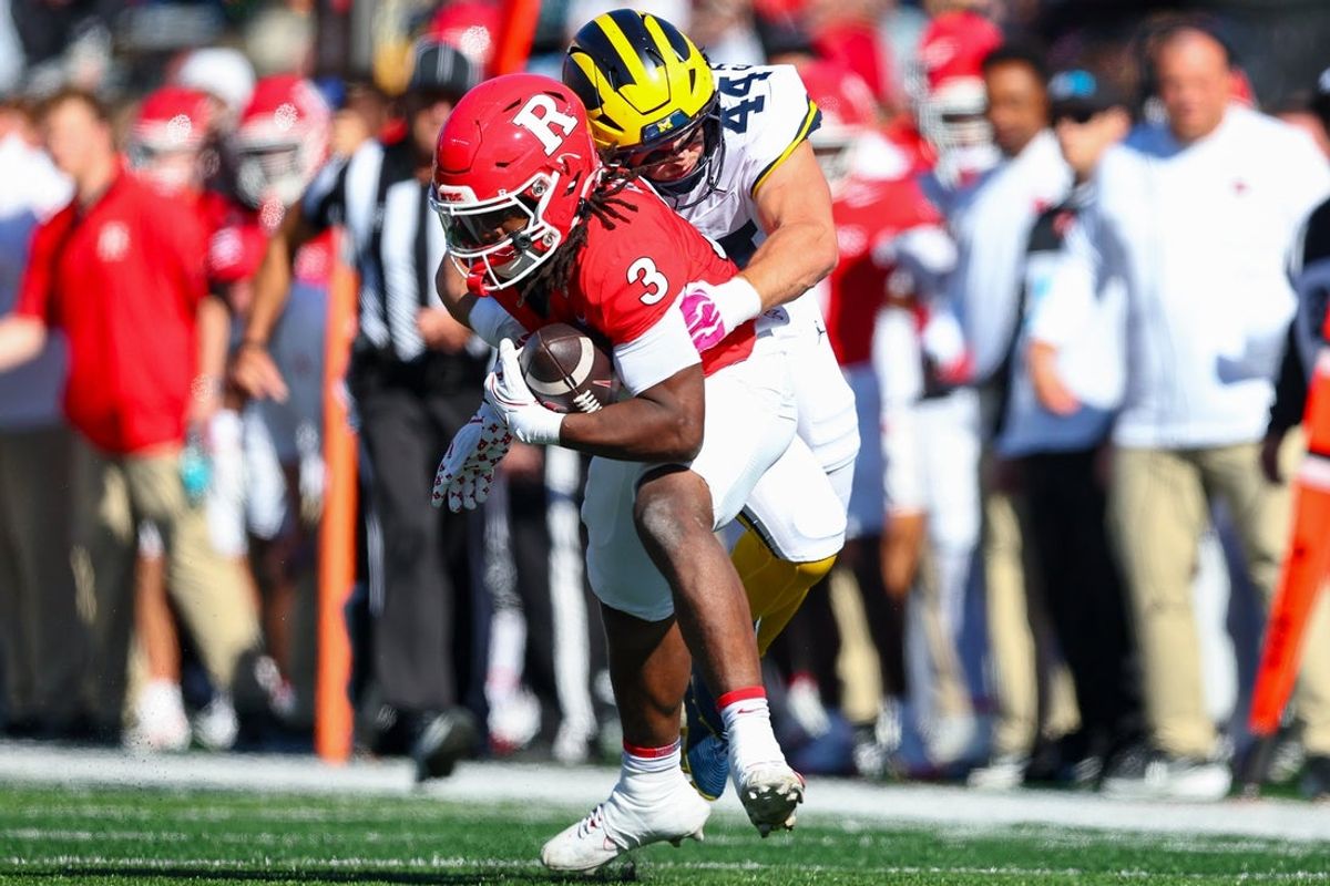 Oct 31, 2026; Piscataway, New Jersey, USA;  Rutgers Scarlet Knights running back Antwan Raymond (3) is tackled by Michigan Wolverines linebacker Nathaniel Staehling (44) during the first half at SHI Stadium. Mandatory Credit: Vincent Carchietta-Imagn Images