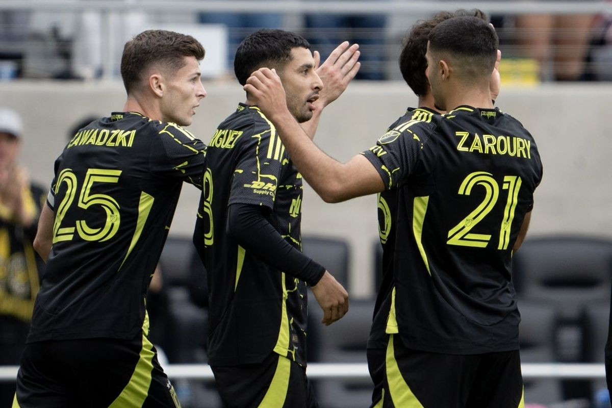 Oct 31, 2026; Columbus, Ohio, USA;  Columbus Crew midfielder Sean Zawadzki (25) and forward Anass Zaroury (21) congratulate forward Santiago Rodriguez (8) after scoring a goal against D.C. United during the second half of Saturday's match at ScottsMiracle-Gro Field.  Mandatory Credit: Barbara Perenic-Imagn Images