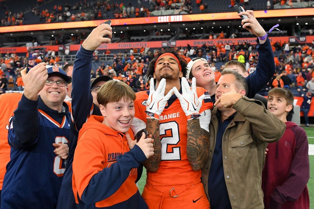 Oct 31, 2026; Syracuse, New York, USA;  Fans pose for a photo with Syracuse Orange wide receiver Umari Hatcher (2) following the game against the Southern Methodist University Mustangs at the JMA Wireless Dome.  Mandatory Credit: Rich Barnes-Imagn Images