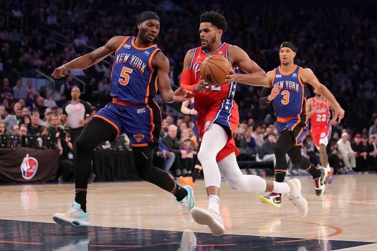 Mar 10, 2024; New York, New York, USA; Philadelphia 76ers forward Tobias Harris (12) drives to the basket against New York Knicks forward Precious Achiuwa (5) and guard Josh Hart (3) during the first quarter at Madison Square Garden.