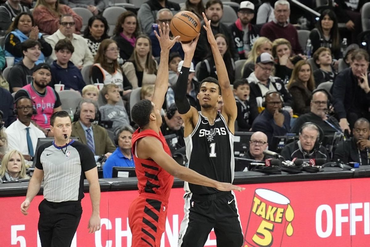 Jan 26, 2024; San Antonio, Texas, USA; San Antonio Spurs forward Victor Wembanyama (1) shoots over Portland Trail Blazers forward Kris Murray (8) during the first half at Frost Bank Center.