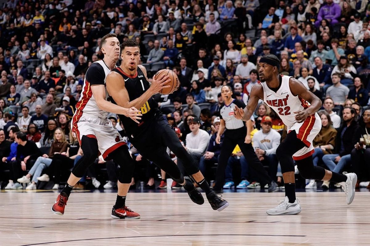 Feb 29, 2024; Denver, Colorado, USA; Denver Nuggets forward Michael Porter Jr. (1) drives to the basket against Miami Heat forward Duncan Robinson (55) in the first quarter at Ball Arena.