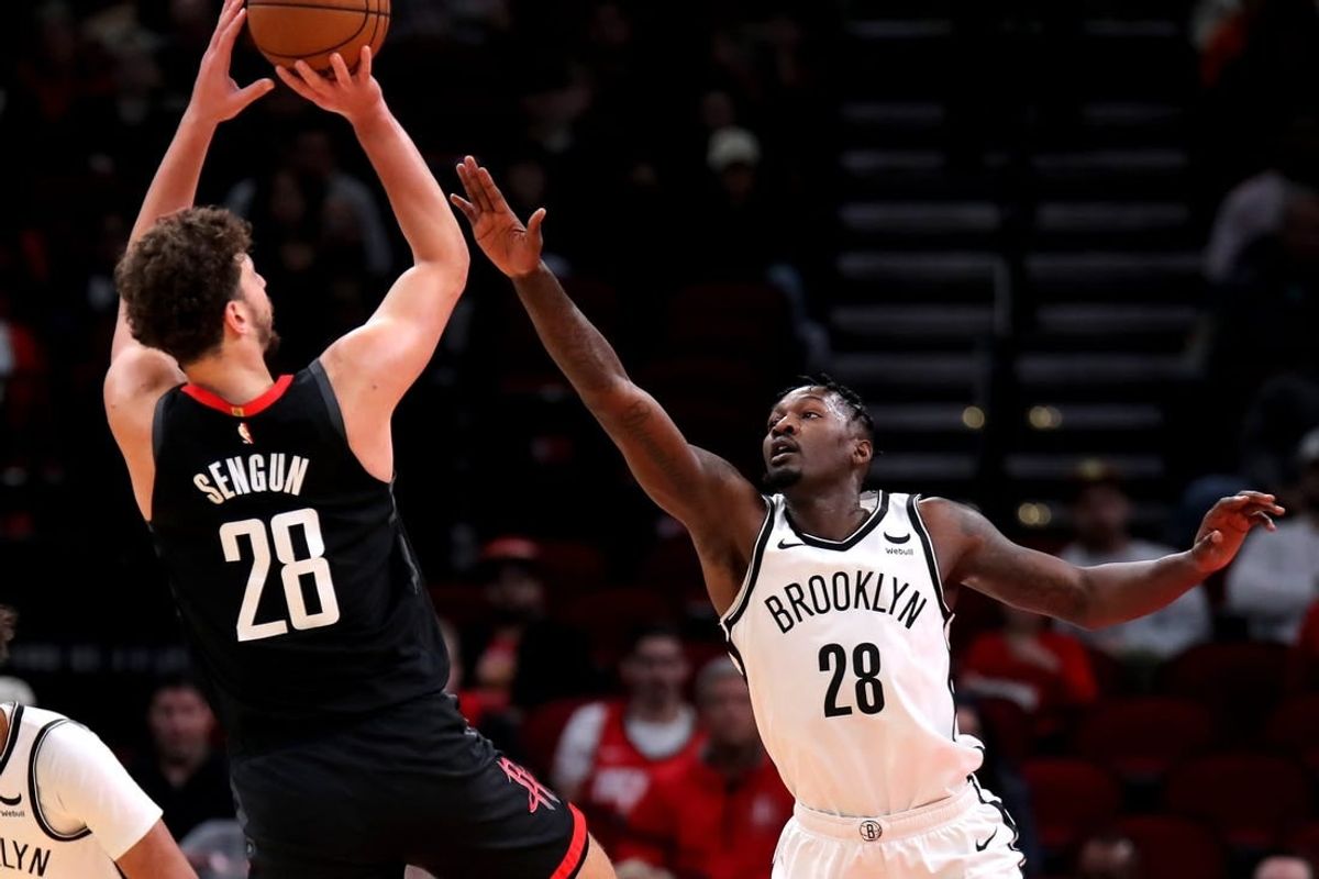 Jan 3, 2024; Houston, Texas, USA; Houston Rockets center Alperen Sengun (28) shoots against Brooklyn Nets forward Dorian Finney-Smith (28) during the first quarter at Toyota Center.