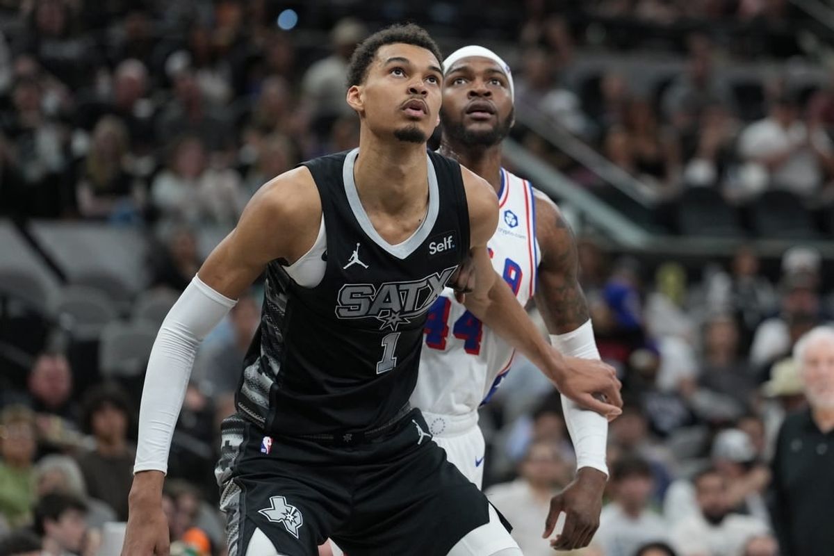 Apr 7, 2024; San Antonio, Texas, USA;  San Antonio Spurs center Victor Wembanyama (1) blocks out Philadelphia 76ers forward Paul Reed (44) in the second half at Frost Bank Center.