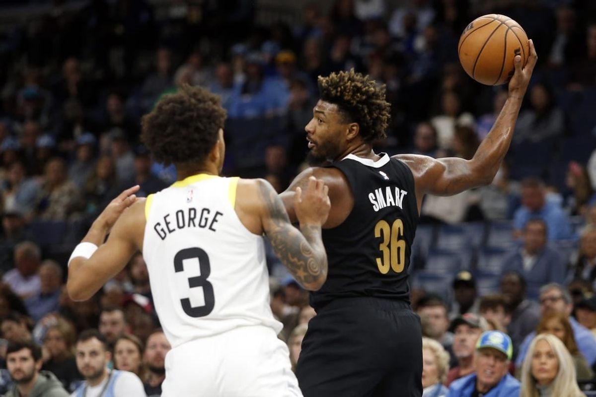 Nov 10, 2023; Memphis, Tennessee, USA; Memphis Grizzlies guard Marcus Smart (36) handles the ball as Utah Jazz guard Keyonte George (3) defends during the first half at FedExForum.