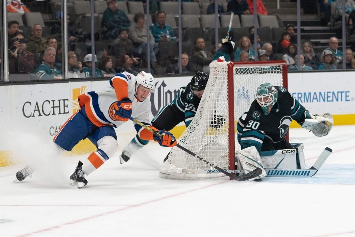 Mar 7, 2024; San Jose, California, USA; New York Islanders center Kyle MacLean (32) attempts to shoot the puck during the first period against San Jose Sharks goaltender Magnus Chrona (30) at SAP Center at San Jose.