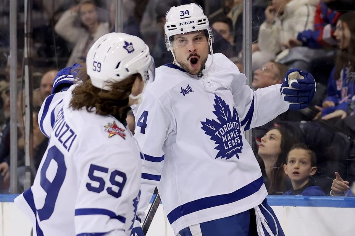 Dec 12, 2023; New York, New York, USA; Toronto Maple Leafs center Auston Matthews (34) celebrates his goal against the New York Rangers with left wing Tyler Bertuzzi (59) during the third period at Madison Square Garden.