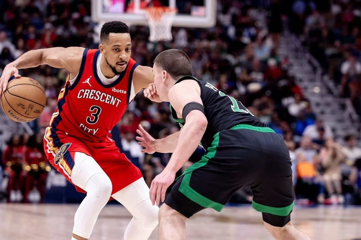 Mar 30, 2024; New Orleans, Louisiana, USA; New Orleans Pelicans guard CJ McCollum (3) dribbles against Boston Celtics guard Payton Pritchard (11) during the second half at Smoothie King Center.