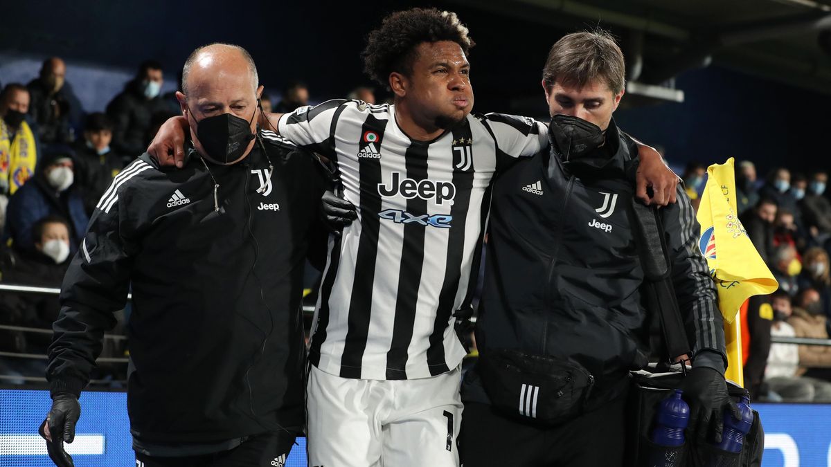 USMNT Midfielder Wes McKennie is helped off the pitch after injuring his foot playing for Juventus in February.