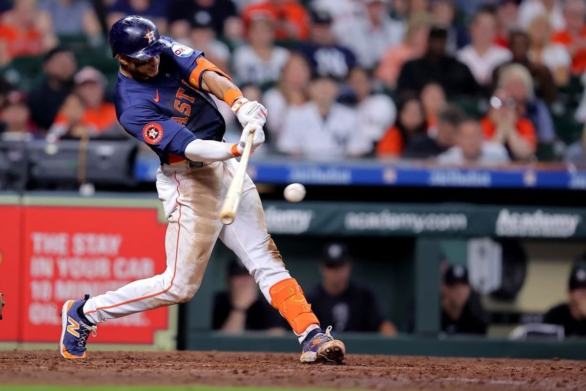 Mar 31, 2024; Houston, Texas, USA; Houston Astros shortstop Jeremy Pena (3) hits a single to right field against the New York Yankees during the ninth inning at Minute Maid Park.