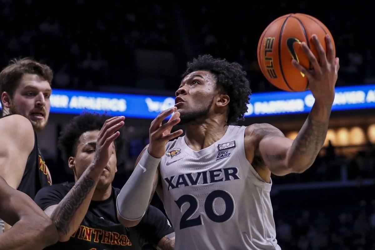 Dec 16, 2023; Cincinnati, Ohio, USA; Xavier Musketeers guard Dayvion McKnight (20) drives to the basket against the Winthrop Eagles in the first half at Cintas Center.