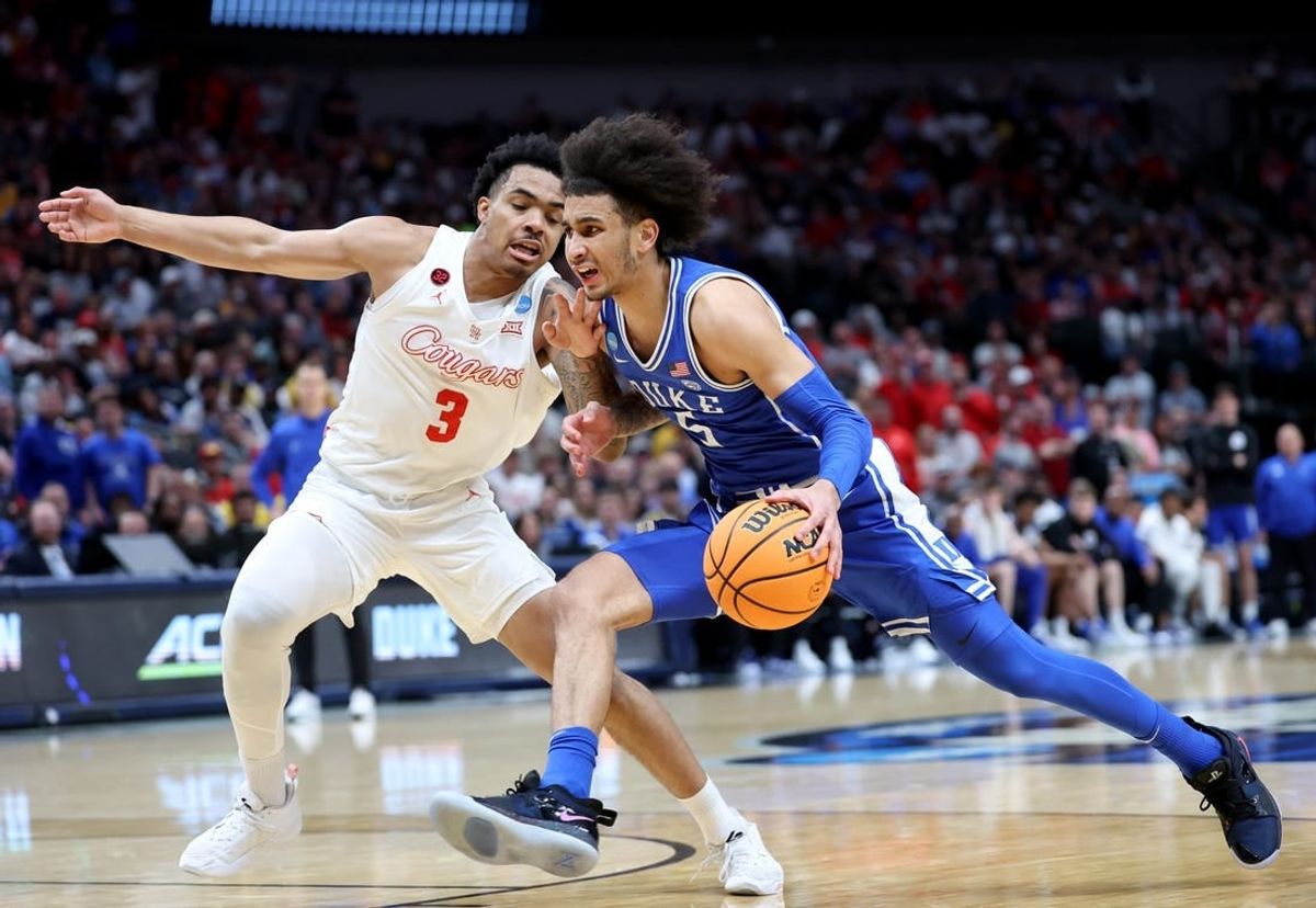 Mar 29, 2024; Dallas, TX, USA; Duke Blue Devils guard Tyrese Proctor (5) drives against Houston Cougars guard Ramon Walker Jr. (3) during the first half in the semifinals of the South Regional of the 2024 NCAA Tournament at American Airlines Center.