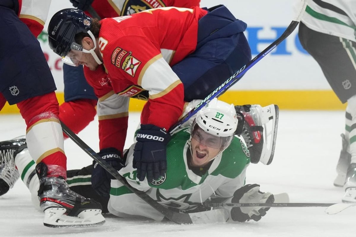 Dec 6, 2023; Sunrise, Florida, USA; Florida Panthers left wing Matthew Tkachuk (19) collides with Dallas Stars left wing Mason Marchment (27) during the first period at Amerant Bank Arena.