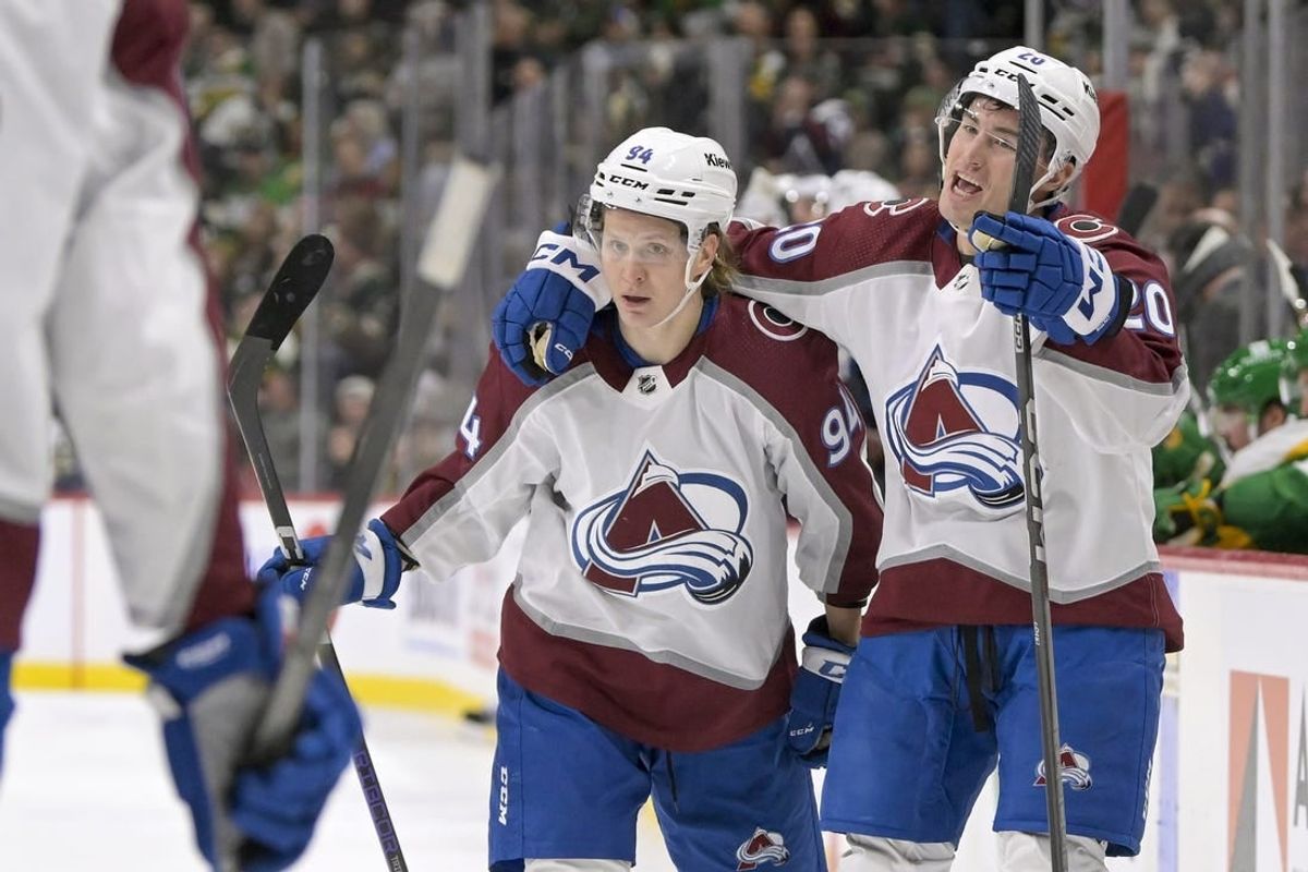 Nov 24, 2023; Saint Paul, Minnesota, USA; Colorado Avalanche forward Ross Colton (20) celebrates his goal against the Minnesota Wild with forward forward Joel Kiviranta (94) during the first period at Xcel Energy Center.