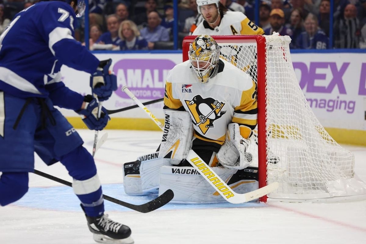 Nov 30, 2023; Tampa, Florida, USA; Pittsburgh Penguins goaltender Tristan Jarry (35) makes save from Tampa Bay Lightning center Anthony Cirelli (71) during the first period at Amalie Arena.