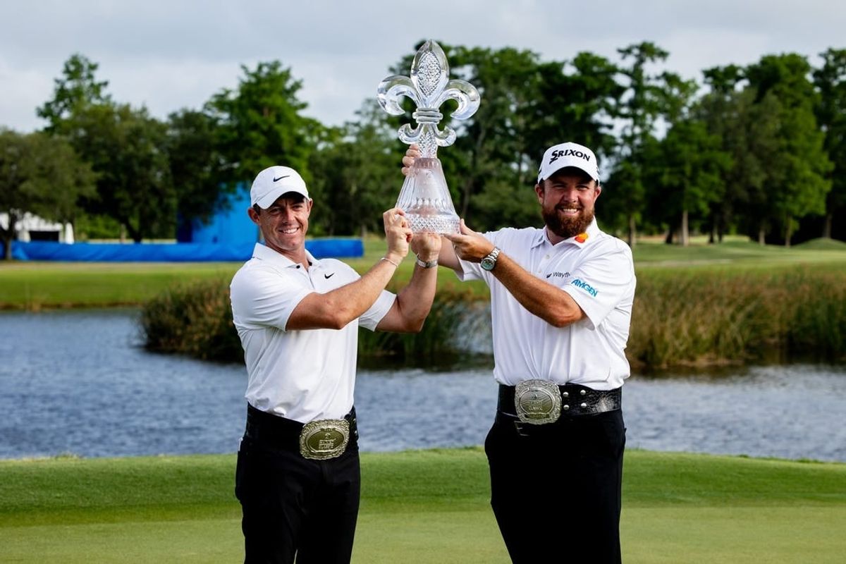 Apr 28, 2024; Avondale, Louisiana, USA; Rory McIlroy  and Shane Lowry pose for fans and the media after winning the Zurich Classic of New Orleans golf tournament.