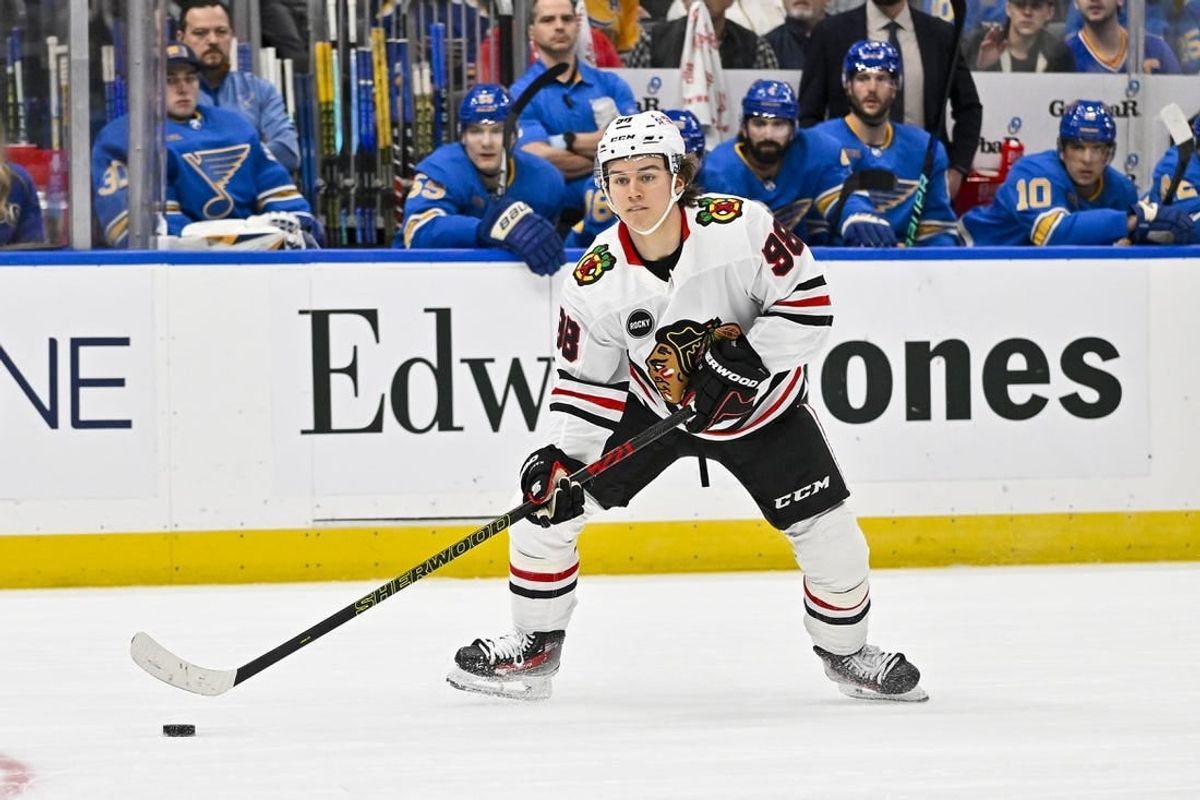 Dec 23, 2023; St. Louis, Missouri, USA;  Chicago Blackhawks center Connor Bedard (98) controls the puck against the St. Louis Blues during the first period at Enterprise Center.