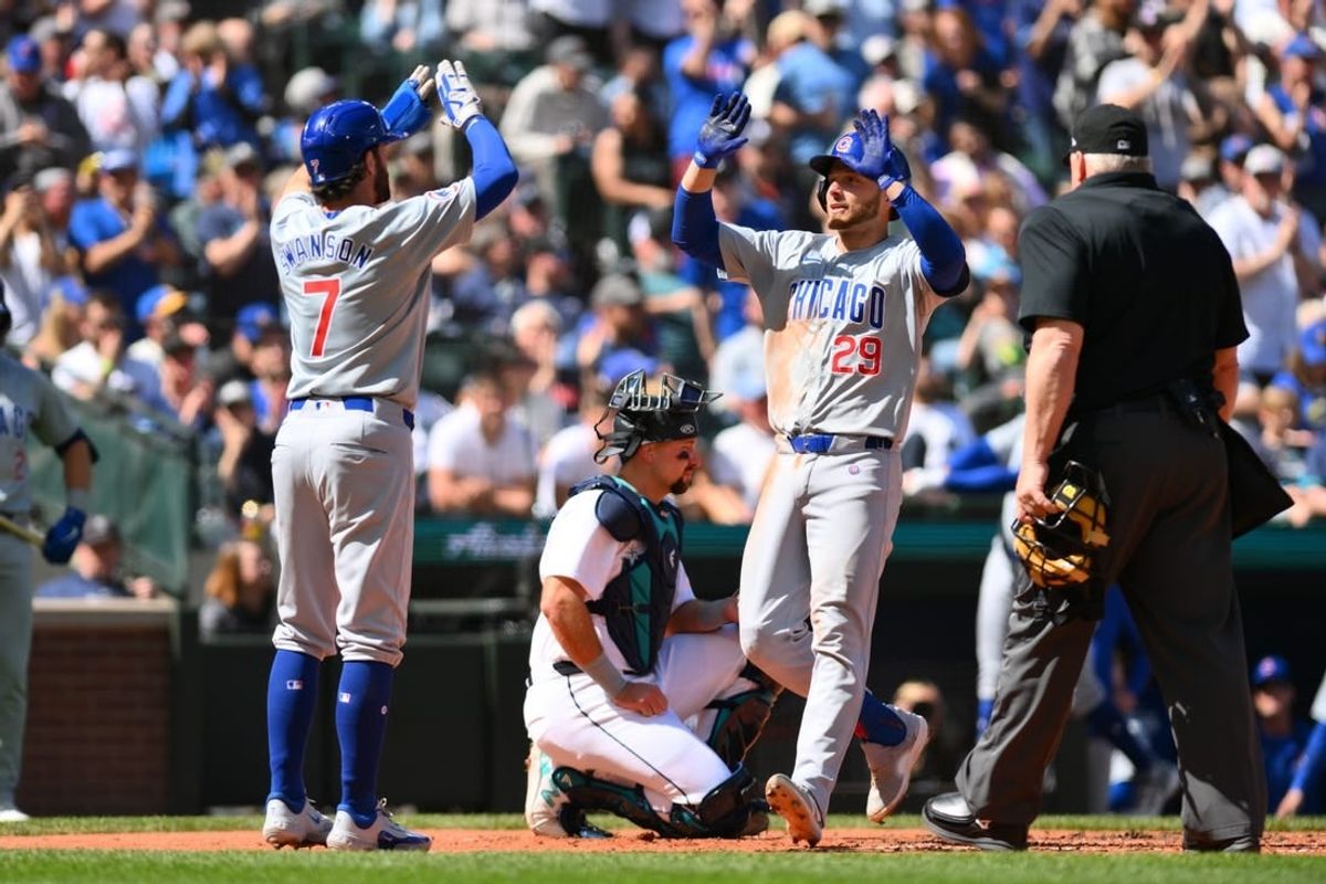 Apr 14, 2024; Seattle, Washington, USA; Chicago Cubs shortstop Dansby Swanson (7) and first baseman Michael Busch (29) celebrate after Busch hit a two-run home run against the Seattle Mariners during the fourth inning at T-Mobile Park.