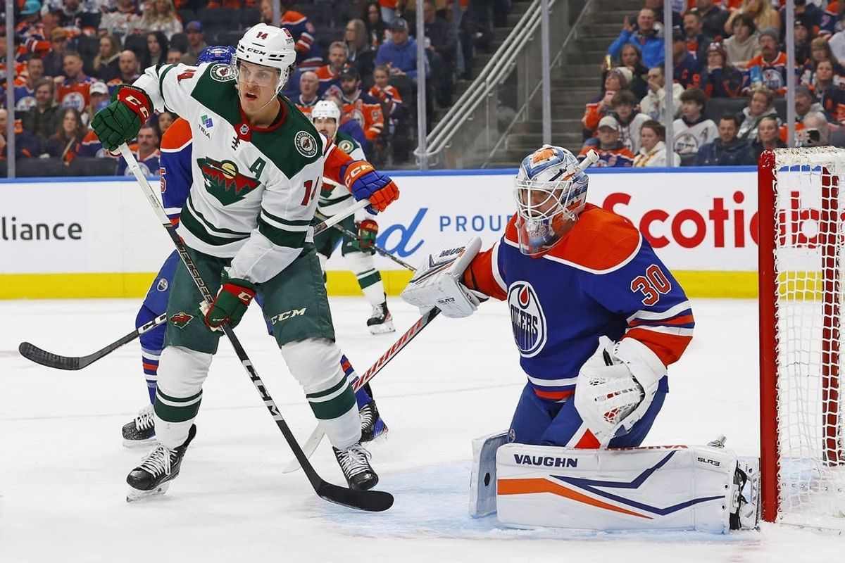 Feb 23, 2024; Edmonton, Alberta, CAN; Minnesota Wild forward Joel Ericksson EK (14) looks for a deletion in front of Edmonton Oilers goaltender Calvin Pickard (30) during the second period at Rogers Place.