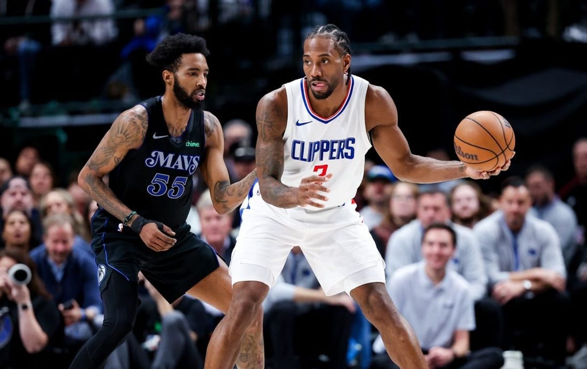 Dec 20, 2023; Dallas, Texas, USA;  LA Clippers forward Kawhi Leonard (2) controls the ball as Dallas Mavericks forward Derrick Jones Jr. (55) defends during the second quarter at American Airlines Center.