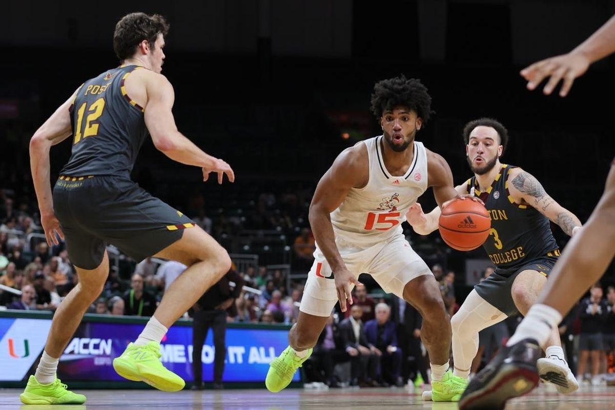 Mar 6, 2024; Coral Gables, Florida, USA; Miami Hurricanes forward Norchad Omier (15) drives to the basket past Boston College Eagles guard Jaeden Zackery (3) during the second half at Watsco Center.
