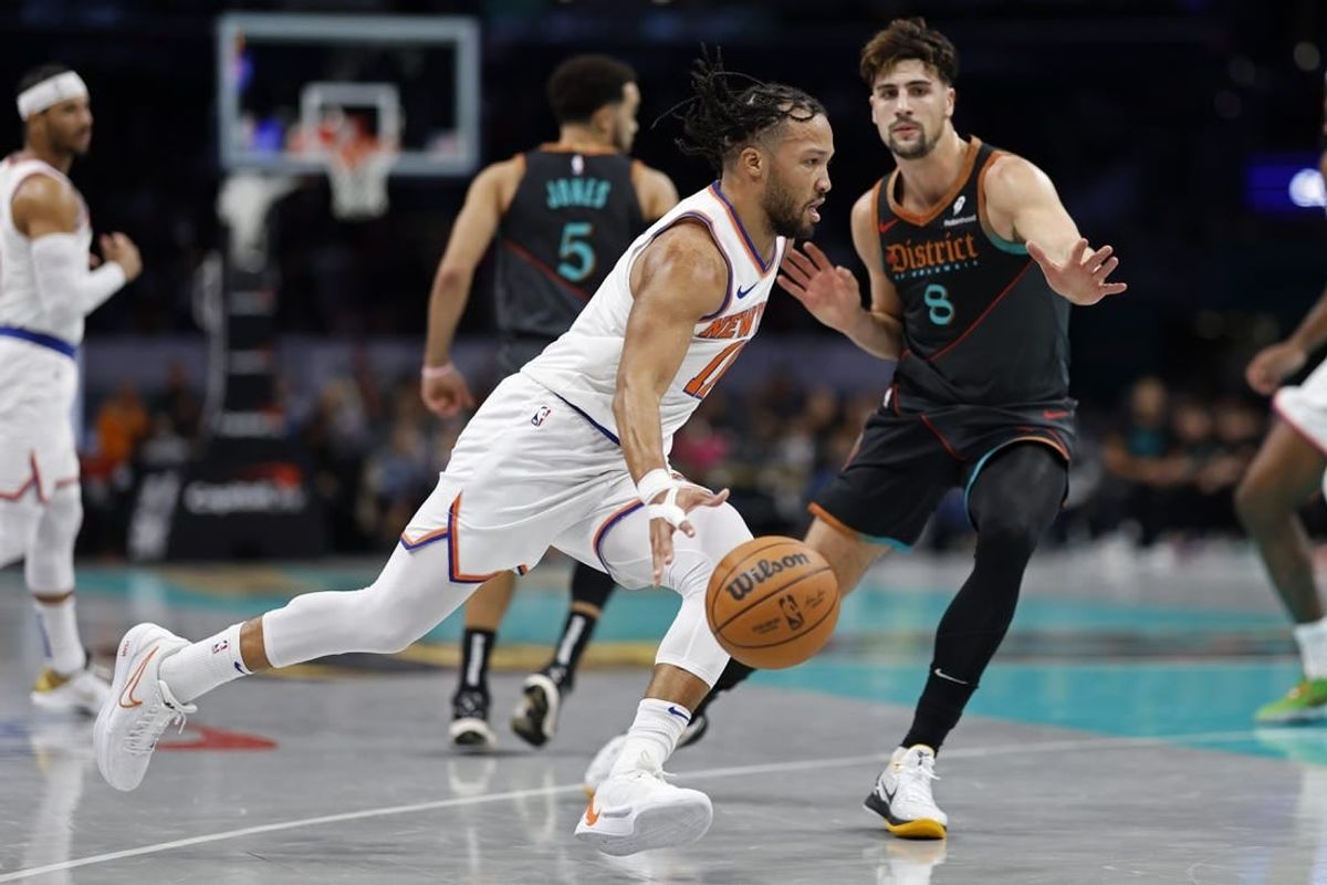 Nov 17, 2023; Washington, District of Columbia, USA; New York Knicks guard Jalen Brunson (11) drives to the basket as Washington Wizards forward Deni Avdija (8) defends in the first quarter at Capital One Arena.