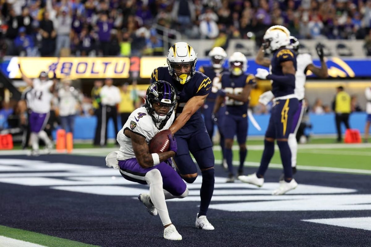 Nov 26, 2023; Inglewood, California, USA; Baltimore Ravens wide receiver Zay Flowers (4) catches a touchdown pass during the second quarter against the Los Angeles Chargers at SoFi Stadium.