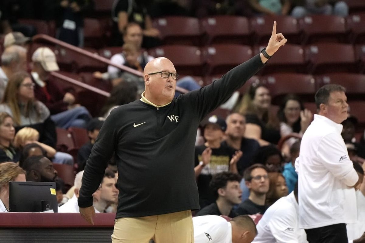 Nov 19, 2023; Charleston, SC, USA; Wake Forest Demon Deacons head coach Steve Forbes sends a play in the first half against the LSU Tigers at TD Arena.