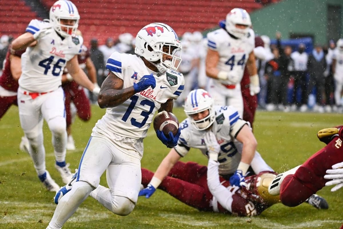 Dec 28, 2023; Boston, MA, USA; Southern Methodist Mustangs wide receiver Roderick Daniels Jr. (13) runs the ball against the Boston College Eagles during the first half at Fenway Park.
