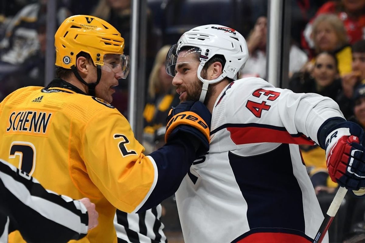 Dec 16, 2023; Nashville, Tennessee, USA; Nashville Predators defenseman Luke Schenn (2) grabs the jersey of Washington Capitals right wing Tom Wilson (43) after a play during the second period at Bridgestone Arena.