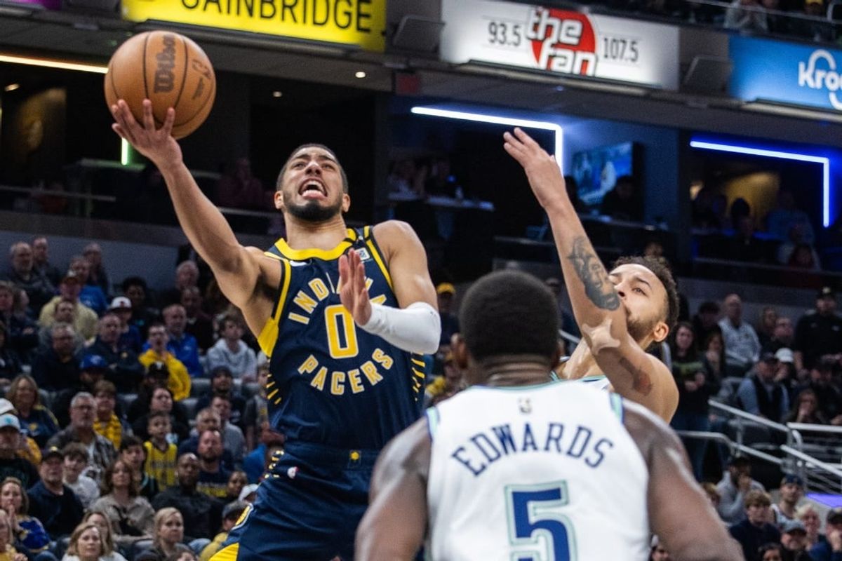 Mar 7, 2024; Indianapolis, Indiana, USA; Indiana Pacers guard Tyrese Haliburton (0) shoots the ball while Minnesota Timberwolves forward Kyle Anderson (1) defends during the second half at Gainbridge Fieldhouse.