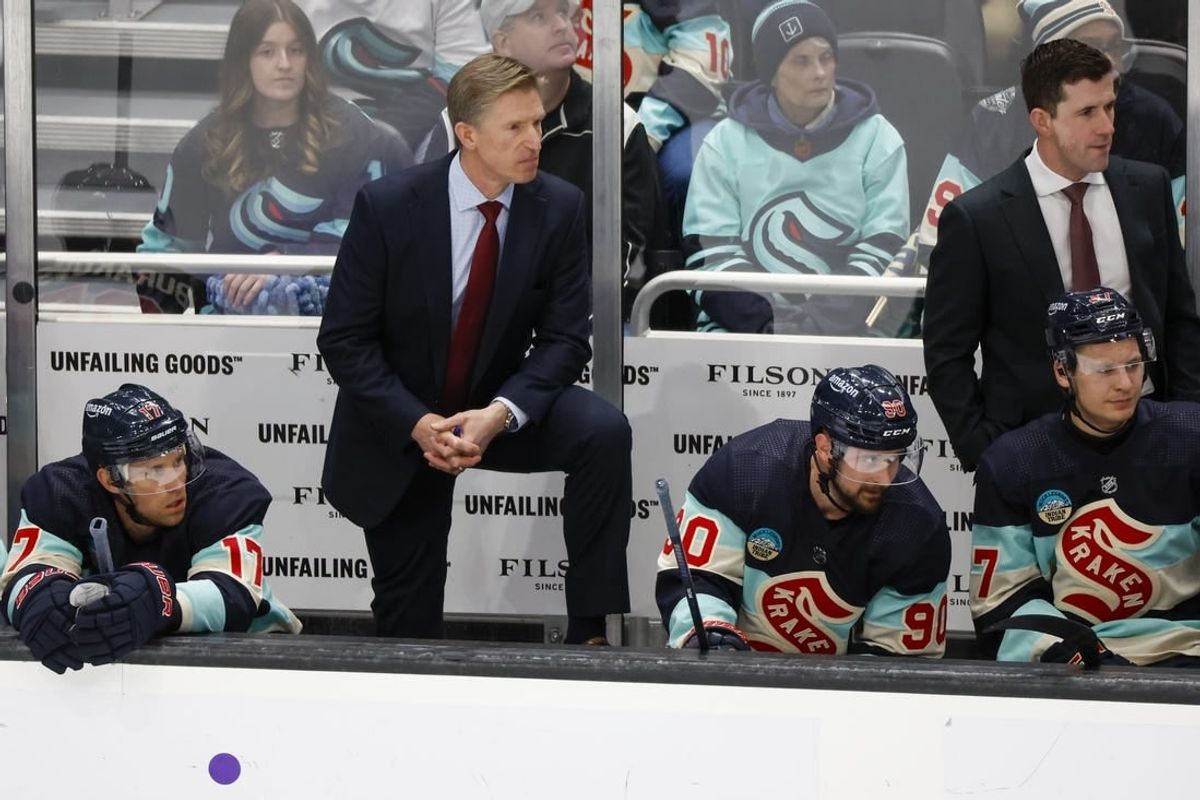 Mar 24, 2024; Seattle, Washington, USA; Seattle Kraken head coach Dave Hakstol, back left, stands behind the bench as center Jaden Schwartz (17) and left wing Tomas Tatar (90) watch the final seconds of the third period against the Montreal Canadiens at Climate Pledge Arena.