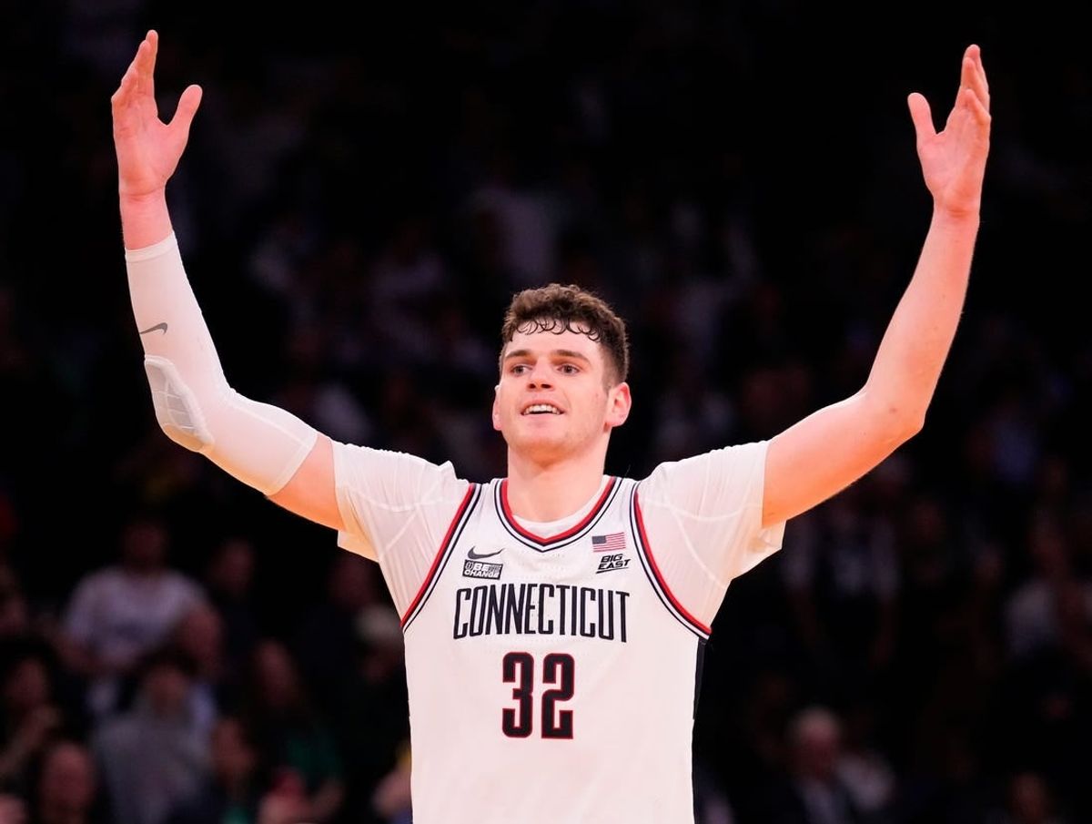Mar 16, 2024; New York City, NY, USA;  Connecticut Huskies center Donovan Clingan (32) celebrates as the clock winds down against Marquette Golden Eagles in the second half at Madison Square Garden.