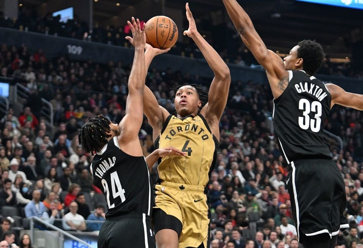 Feb 22, 2024; Toronto, Ontario, CAN;   Toronto Raptors forward Scottie Barnes (4) shoots the ball as Brooklyn Nets guard Cam Thomas (24) and center Nic Claxton (33) defend in the first half at Scotiabank Arena.