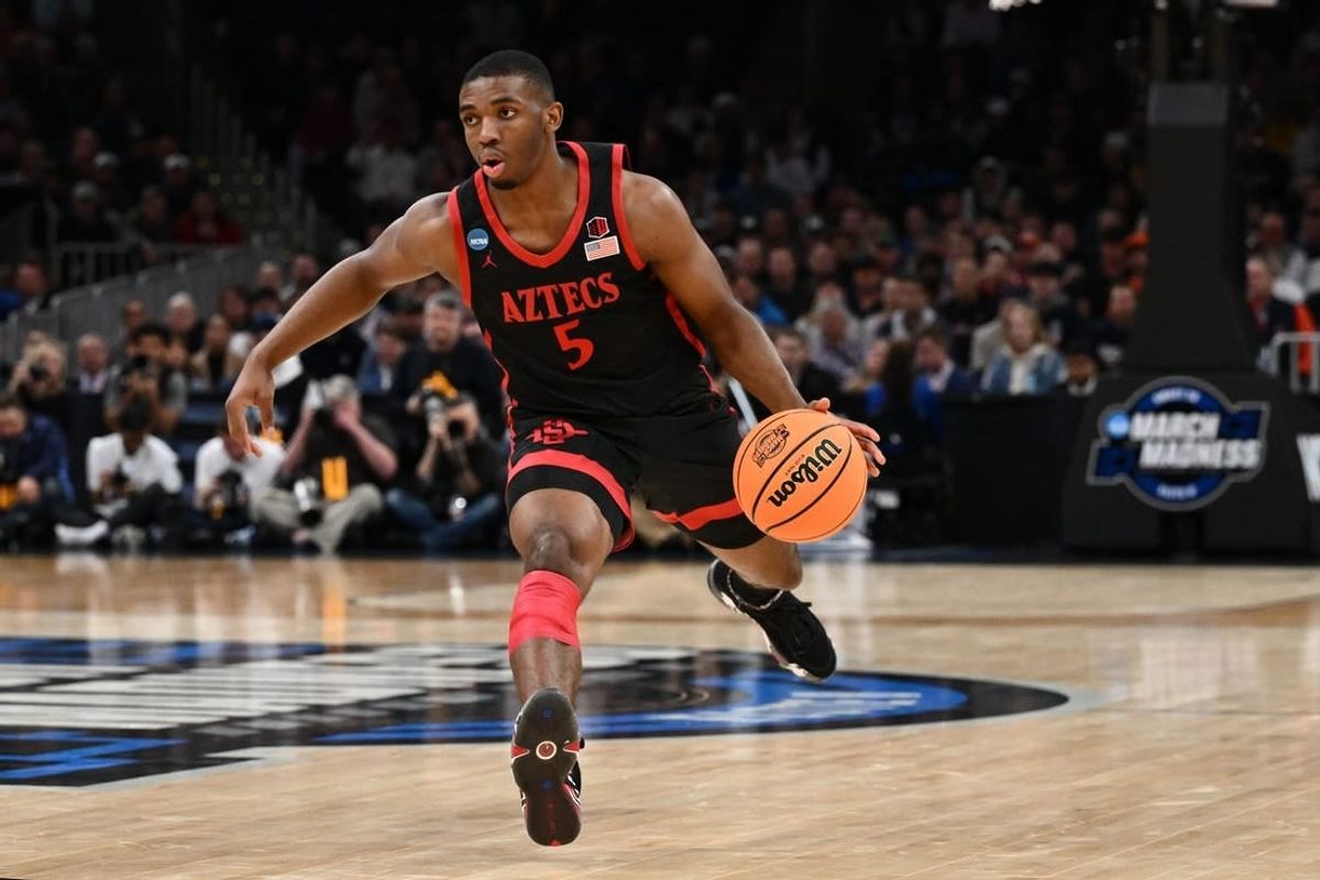 Mar 28, 2024; Boston, MA, USA; San Diego State Aztecs guard Lamont Butler (5) dribbles the ball against the Connecticut Huskies in the semifinals of the East Regional of the 2024 NCAA Tournament at TD Garden.