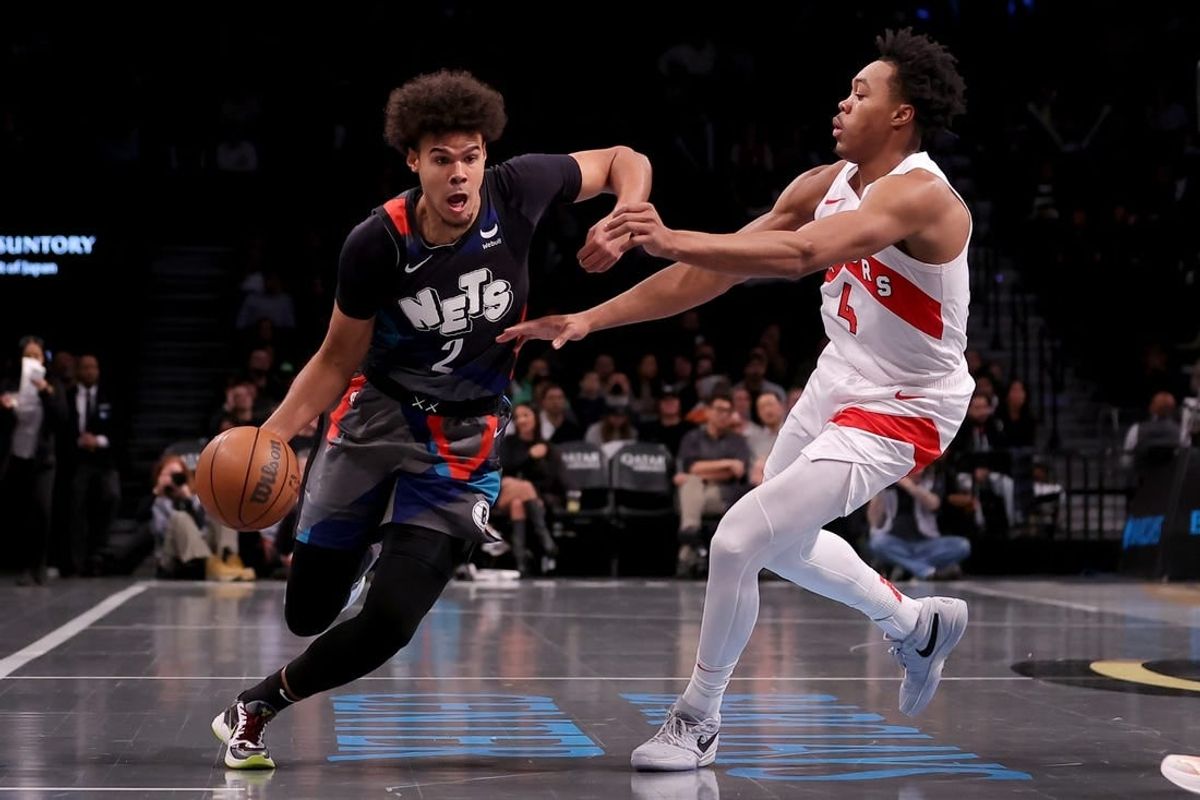 Nov 28, 2023; Brooklyn, New York, USA; Brooklyn Nets forward Cameron Johnson (2) controls the ball against Toronto Raptors forward Scottie Barnes (4) during the second quarter at Barclays Center.