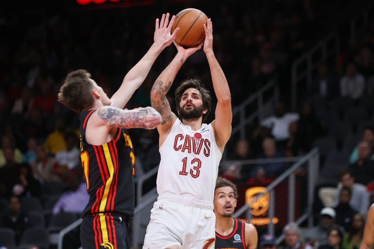 Mar 28, 2023; Atlanta, Georgia, USA; Cleveland Cavaliers guard Ricky Rubio (13) shoots over Atlanta Hawks guard Vit Krejci (27) in the second quarter at State Farm Arena.