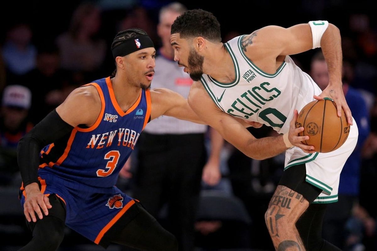 Feb 24, 2024; New York, New York, USA; Boston Celtics forward Jayson Tatum (0) controls the ball against New York Knicks guard Josh Hart (3) during the third quarter at Madison Square Garden.