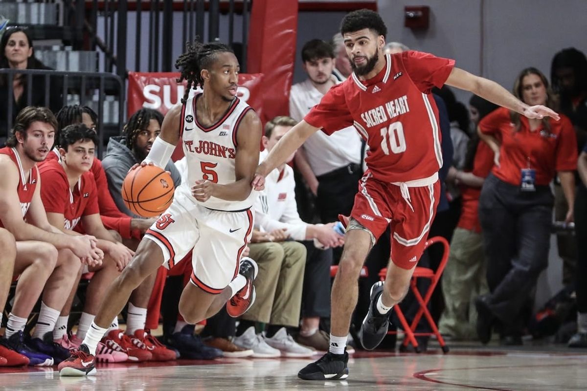 Dec 6, 2023; Queens, New York, USA; St. John's Red Storm guard Daniss Jenkins (5) drives past Sacred Heart Pioneers guard Kyle McGee (10) in the first half at Carnesecca Arena.