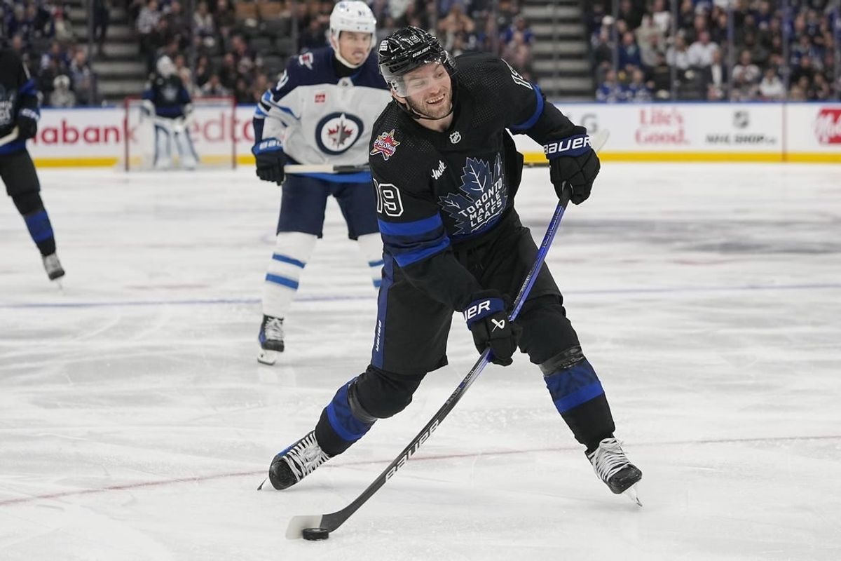 Jan 24, 2024; Toronto, Ontario, CAN; Toronto Maple Leafs forward Calle Jarnkrok (19) goes to shoot the puck against the Winnipeg Jets  during the third period at Scotiabank Arena.