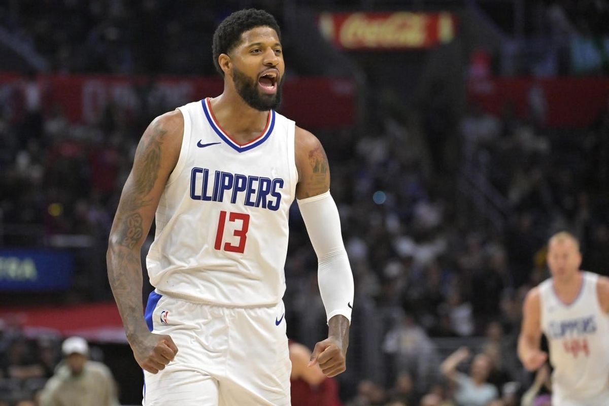 Apr 7, 2024; Los Angeles, California, USA; Los Angeles Clippers forward Paul George (13) celebrates after a three point basket in the fourth quarter against the Cleveland Cavaliers at Crypto.com Arena.