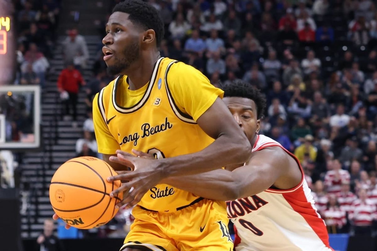 Mar 21, 2024; Salt Lake City, UT, USA; Long Beach State 49ers guard Jadon Jones (12) defended by Arizona Wildcats guard Jaden Bradley (0) during the second half in the first round of the 2024 NCAA Tournament at Vivint Smart Home Arena-Delta Center.