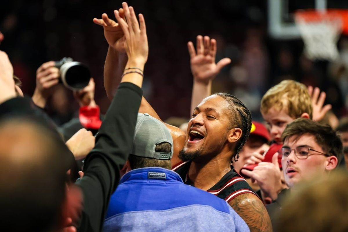 Jan 23, 2024; Columbia, South Carolina, USA; South Carolina Gamecocks guard Ta'Lon Cooper (55) celebrates with students after beating the Kentucky Wildcats at Colonial Life Arena.