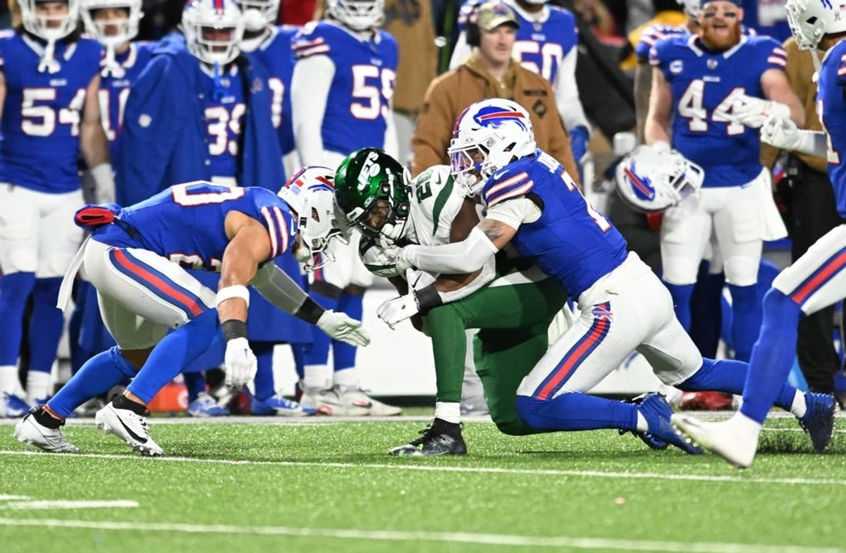 Nov 19, 2023; Orchard Park, New York, USA; Buffalo Bills safety Taylor Rapp (left) was injured on a tackle of New York Jets running back Breece Hall (20) requiring an ambulance in the second quarter. Also in the play is Buffalo Bills cornerback Taron Johnson (7) at Highmark Stadium.