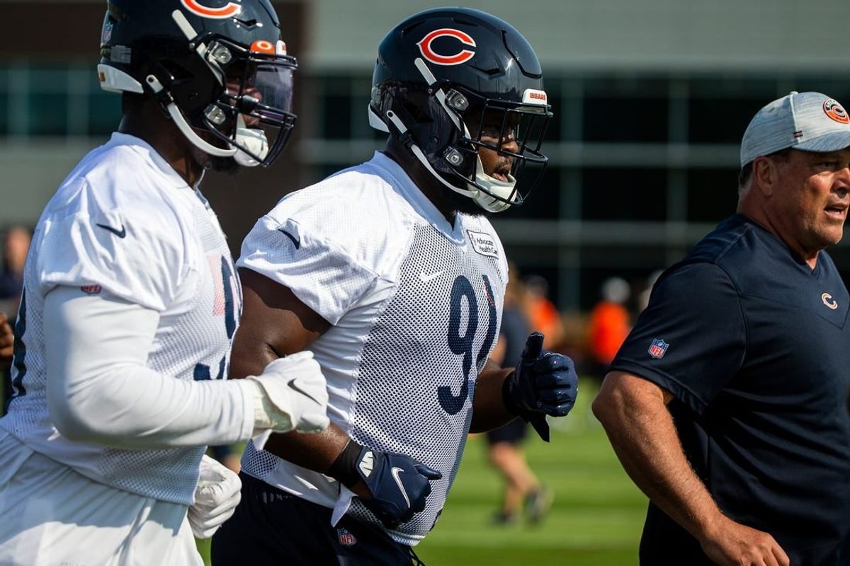 Jul 29, 2021; Lake Forest, IL, USA; Chicago Bears nose tackle Eddie Goldman (91) runs a lap around the field at the start of a Chicago Bears training camp session at Halas Hall.
