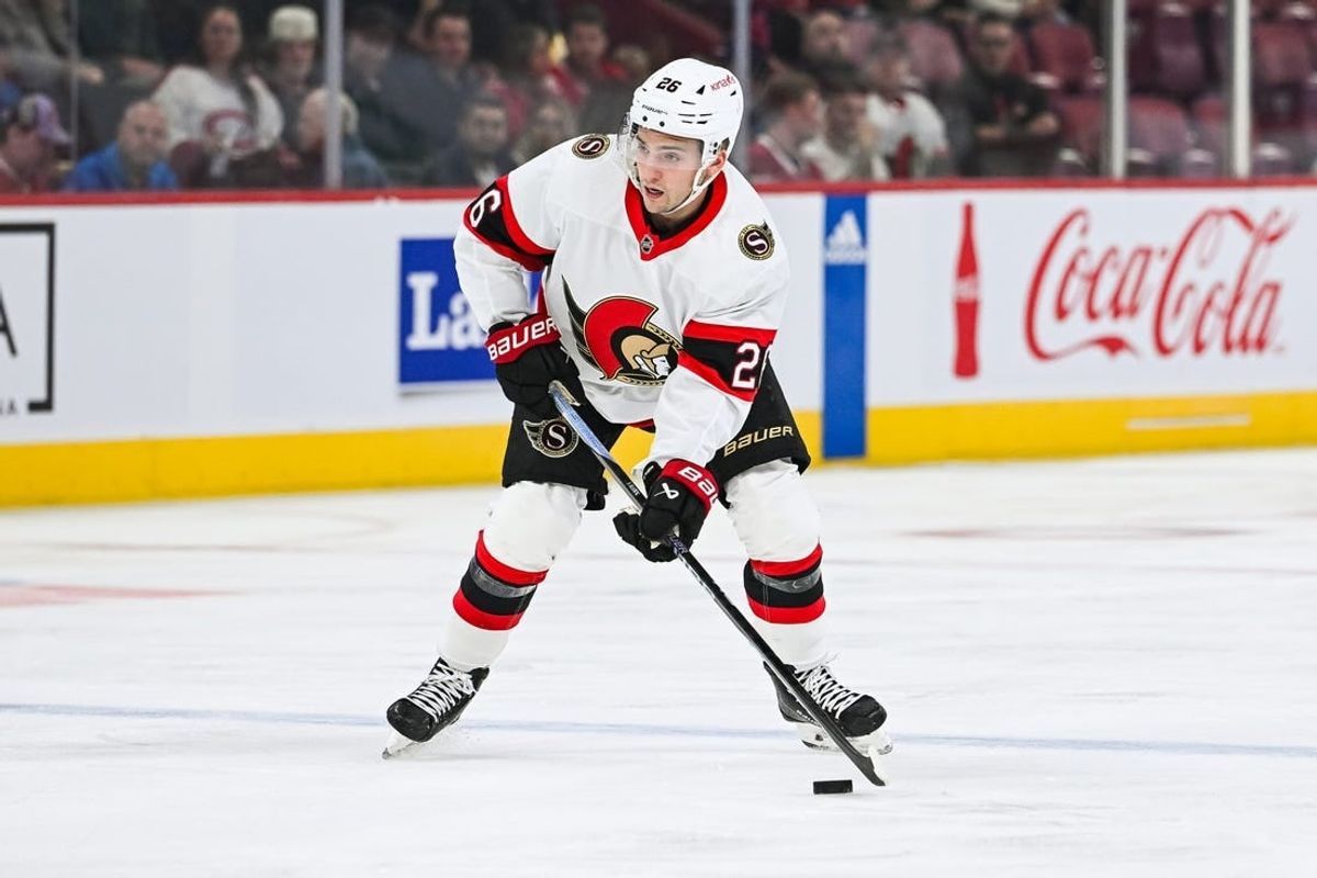 Sep 27, 2023; Montreal, Quebec, CAN; Ottawa Senators defenseman Erik Brannstrom (26) plays the puck against the Montreal Canadiens during the first period at Bell Centre.