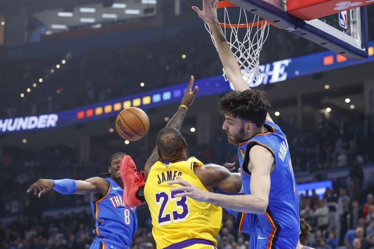 Nov 30, 2023; Oklahoma City, Oklahoma, USA; Los Angeles Lakers forward LeBron James (23), Oklahoma City Thunder forward Chet Holmgren (7) and forward Jalen Williams (8) fight for a rebound during the first quarter at Paycom Center.